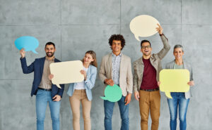 sign business man woman holding blank group message team businessman banner speech bubble copy space young showing businesswoman communication teamwork colleague Portrait of a group of young business people in office. Speech bubble, team and comment by business people holding sign, news and voice icon feeling excited on social media. Group, opinion and poll by employees concept