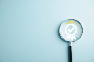 Certification and ISO quality concept illustrated with a magnifying glass highlighting Magnifying glass reveals an aligned icon, symbolizing quality assurance certificate. Emphasizing the importance of certification and ISO quality concept for confidence in good service.